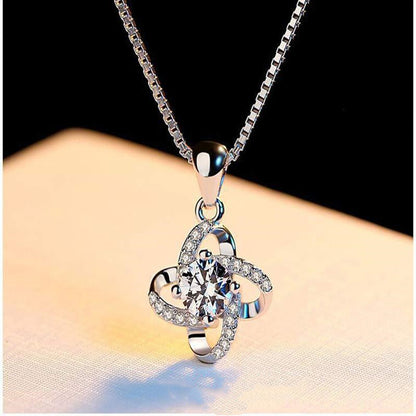 A Four-Leaf Clover Pendant Clavicle Chain from Maramalive™ with diamonds on it.
