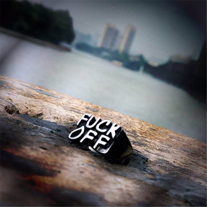A person wearing a Fashion Retro Gothic Punk Ring from Maramalive™ with the word 'fuck off' on it.