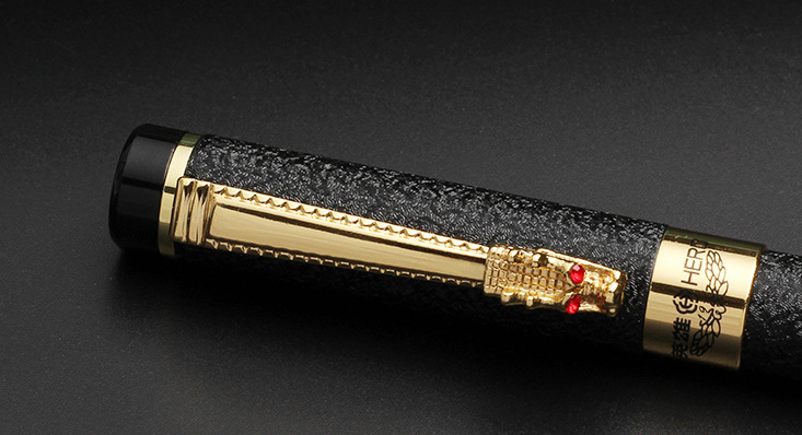A Maramalive™ Classic Design Brand Hero Dragon Crystal Ink Fountain Pen sitting on top of a green box.