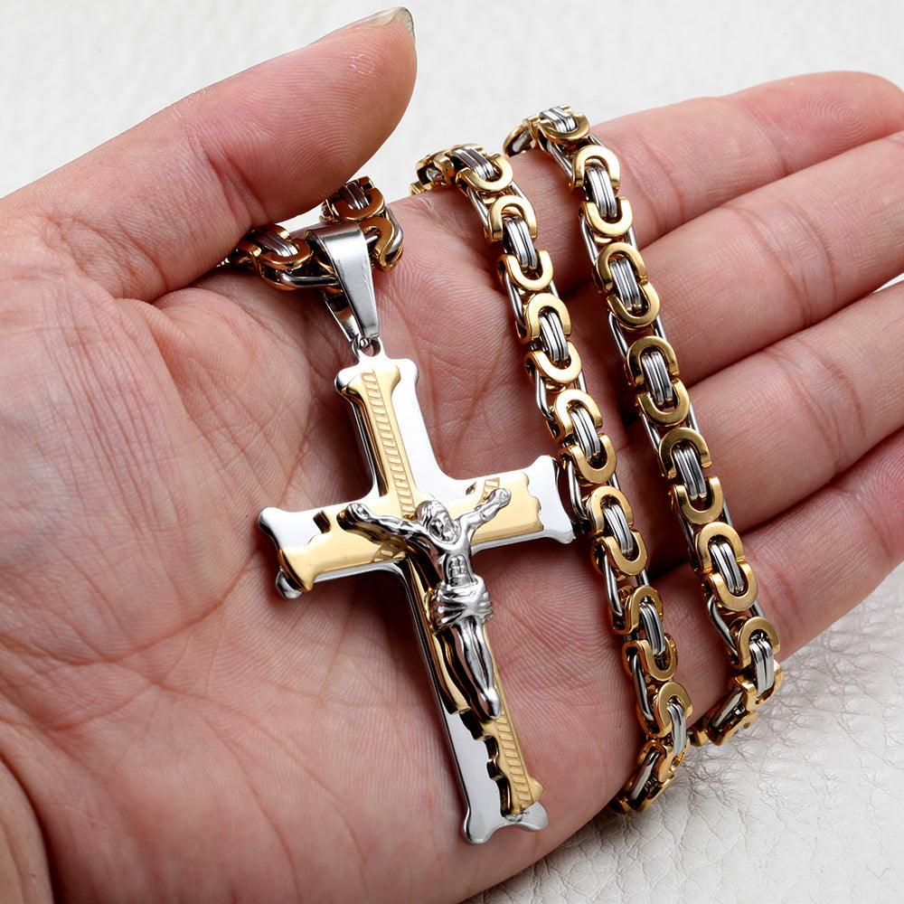 A person holding a Maramalive™ Titanium Steel Cross Necklace with 6M Emperor Chain.