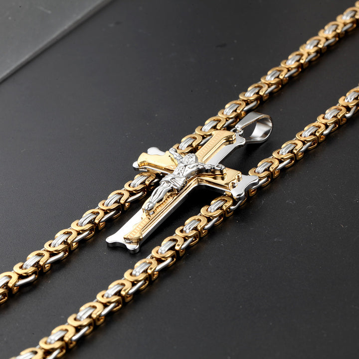 A person holding a Maramalive™ Titanium Steel Cross Necklace with 6M Emperor Chain.