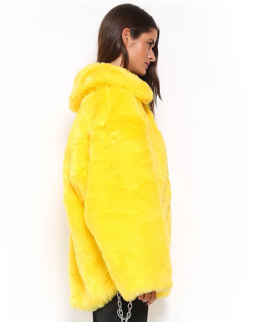 A woman flaunting a medium-length, yellow Maramalive™ Bright Yellow Plunk Faux Fur Coat - Cool Fake Fur Jacket