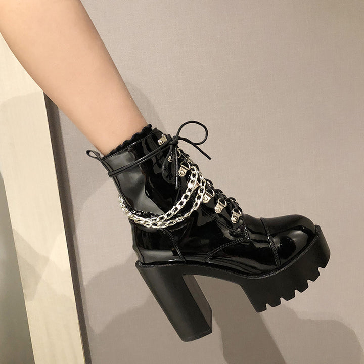 A pair of Lolita Gothic Mary Jane Womens Boots Platform Leather Martin Boots from Maramalive™ with chains on them.