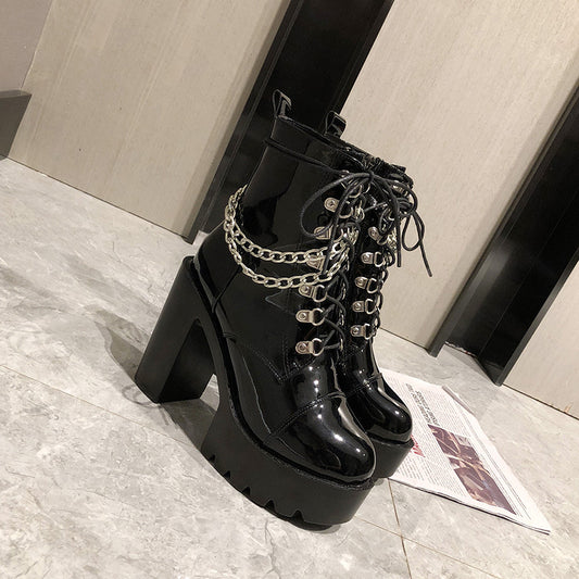 A pair of Lolita Gothic Mary Jane Womens Boots Platform Leather Martin Boots from Maramalive™ with chains on them.