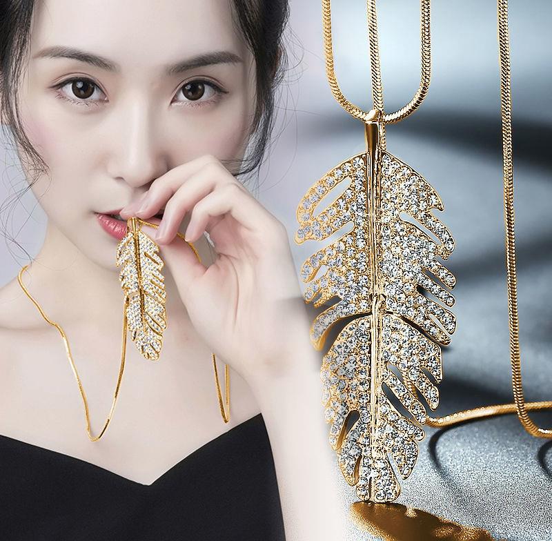 A Maramalive™ gold plated necklace with a Stunning Crystal Long Necklace & Pendant for Women.