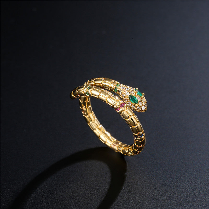 A MaramaliveTM gold snake ring with multi colored stones.