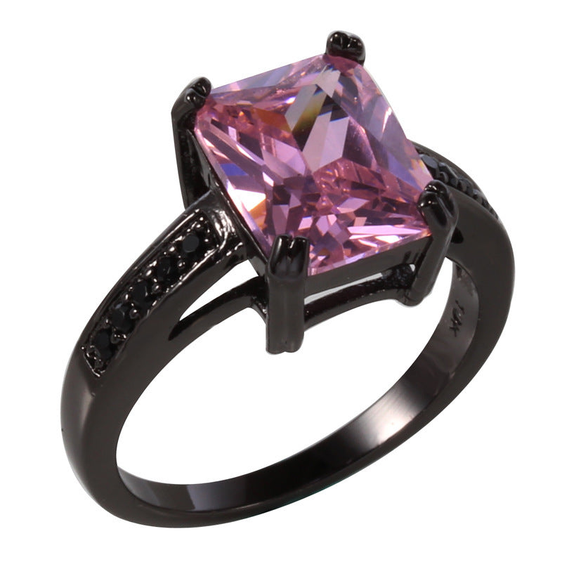 A Maramalive™ pink topaz ring with black diamonds.