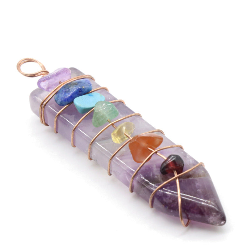 A person is holding a group of different colored Maramalive™ Crystal Arrow Chakra Pendants.
