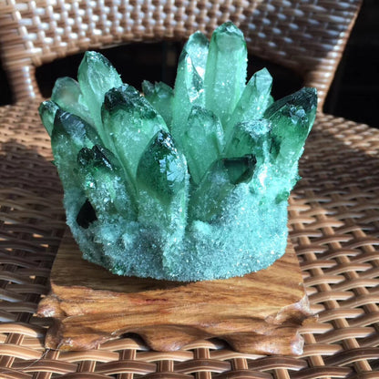 A person holding a Maramalive™ Green Crystal Cluster Ore Ornaments Base.