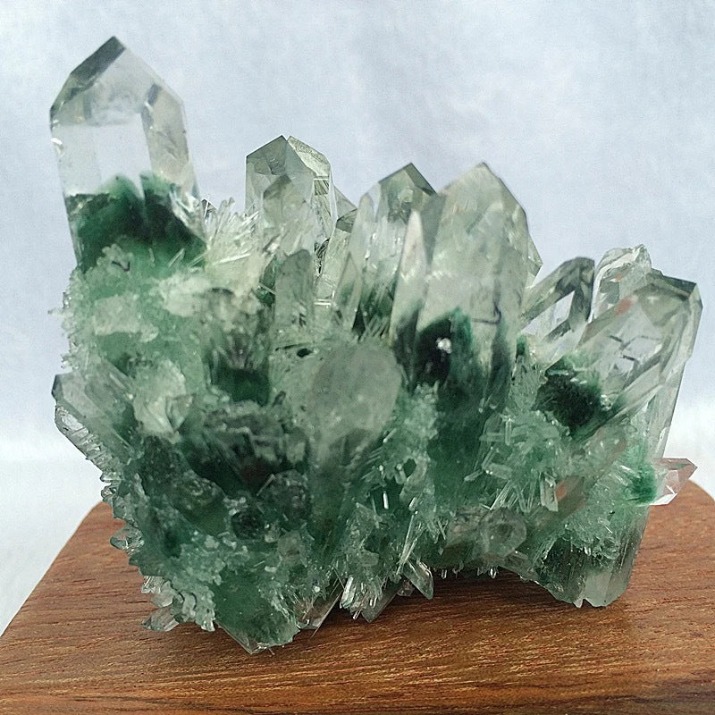 A person holding a Maramalive™ Green Crystal Cluster Ore Ornaments Base.