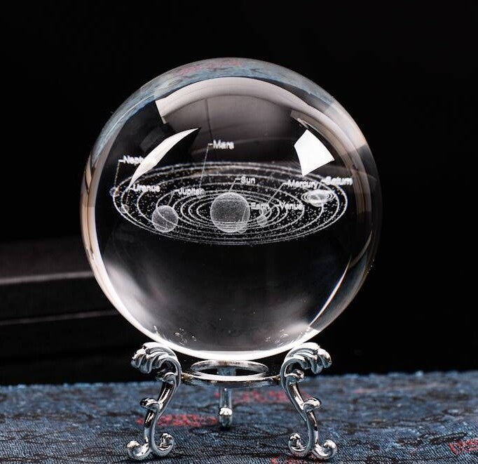 A Galaxy Crystal Ball with a planet in it, made by Maramalive™.