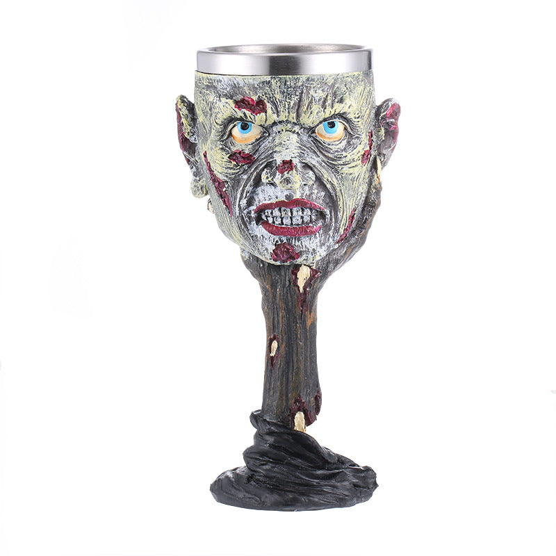 A person holding a Skull Wine Glass with the Maramalive™ brand name on it.