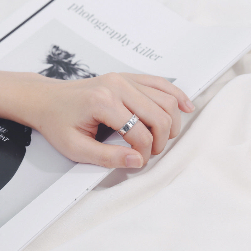 A silver Discover Your Creative Side with the Digital Ruler Ring by Maramalive™ with a clock on it.