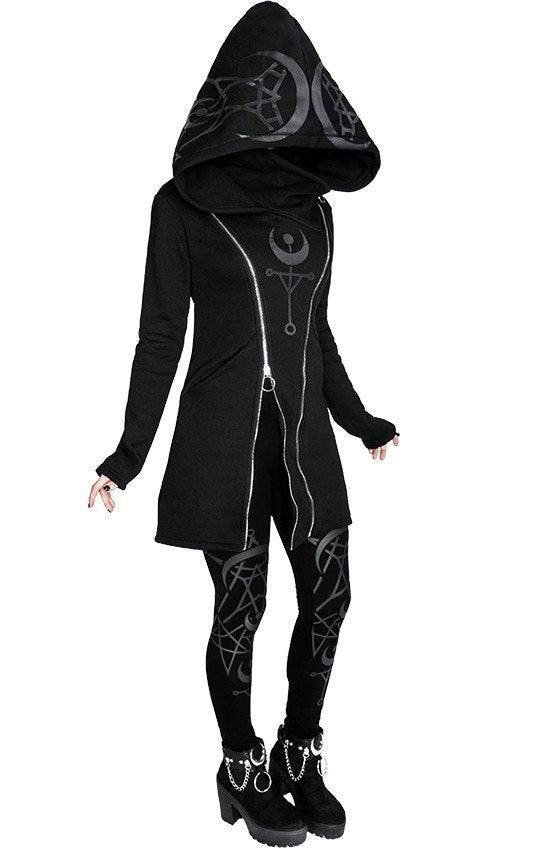 Person wearing a black, Maramalive™ Punk Style Printed Long Sleeved Hooded Double Zipper Sweater Long with silver geometric designs, zipper details on the jacket, matching leggings, and platform shoes with metal embellishments.