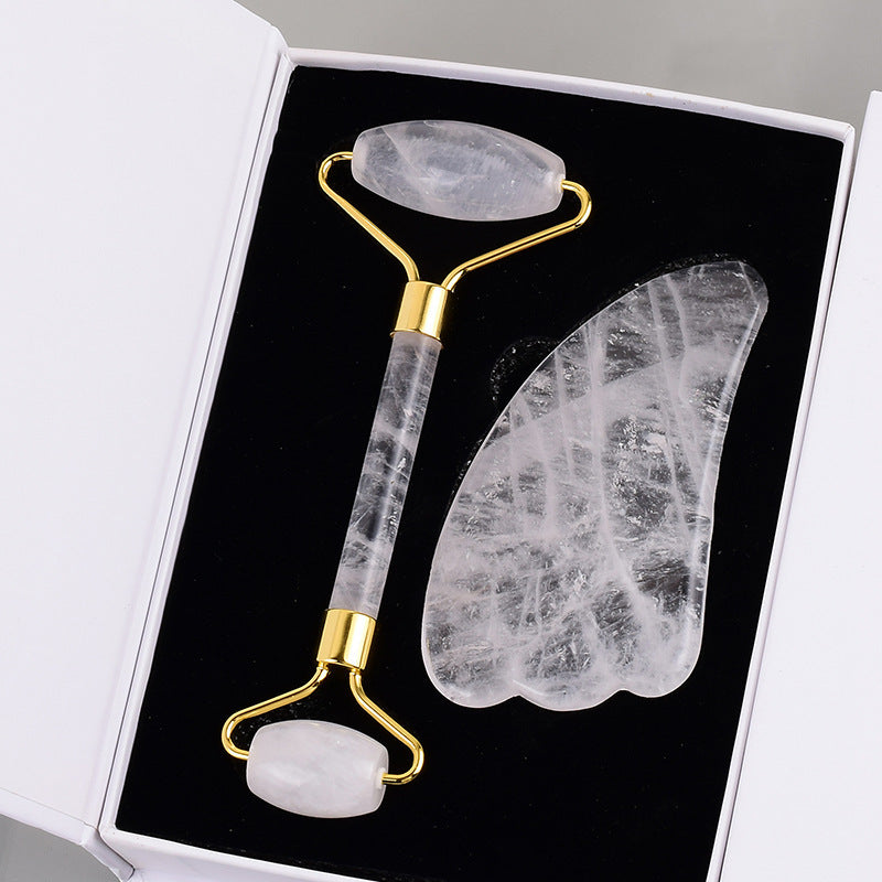 A gift box with a Maramalive™ Stone Roller Massager Crystal Beauty Instrument Transparent Crystal and a gold plated spatula.