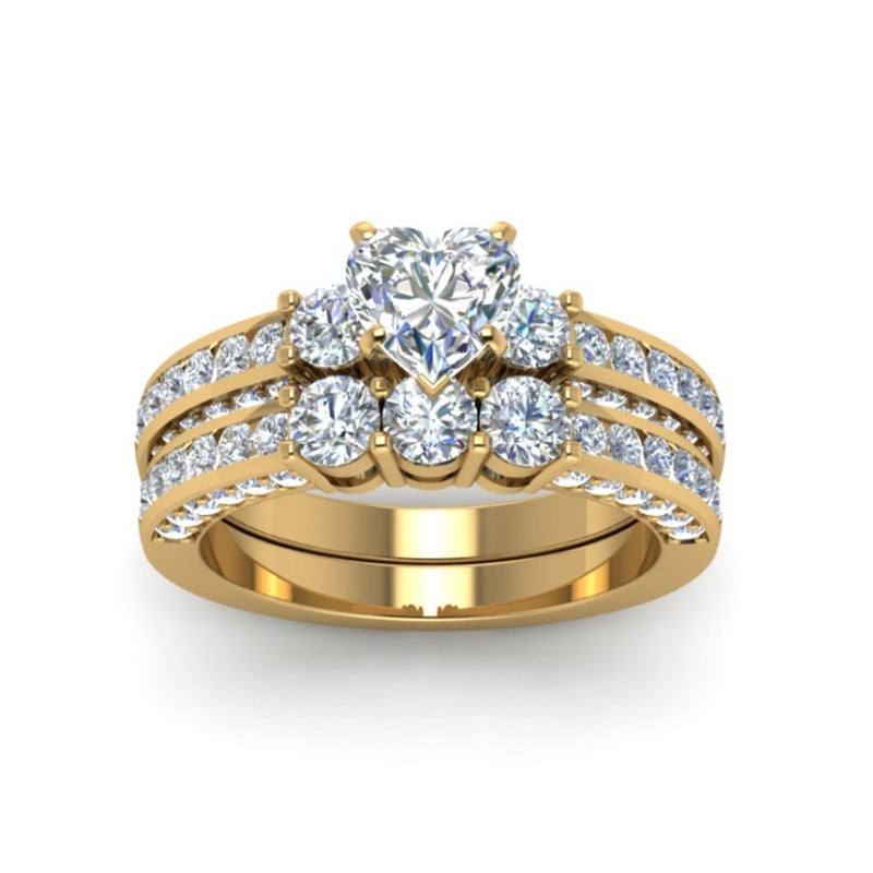 A Zircon Gold Dragon Ring Ring For Couples set with a heart and diamonds, branded as Maramalive™.