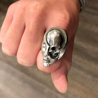 A Punk Gothic Motorcyclist Ring with a skull and face on it by Maramalive™.