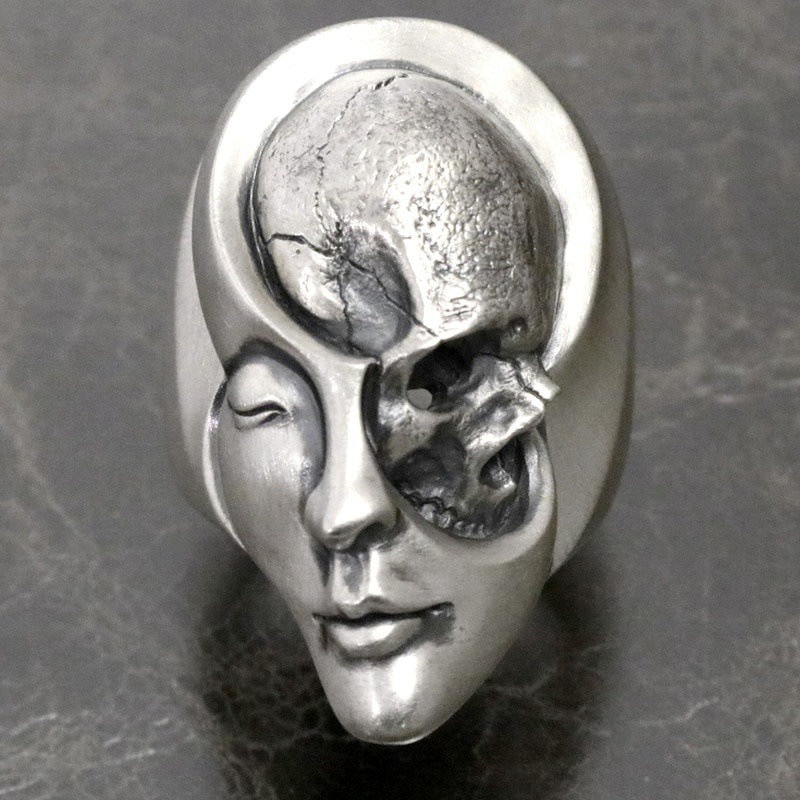 A Punk Gothic Motorcyclist Ring with a skull and face on it by Maramalive™.