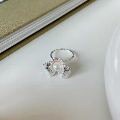 An Irregular Flower Pearl Ring with a pearl in the middle by Maramalive™.