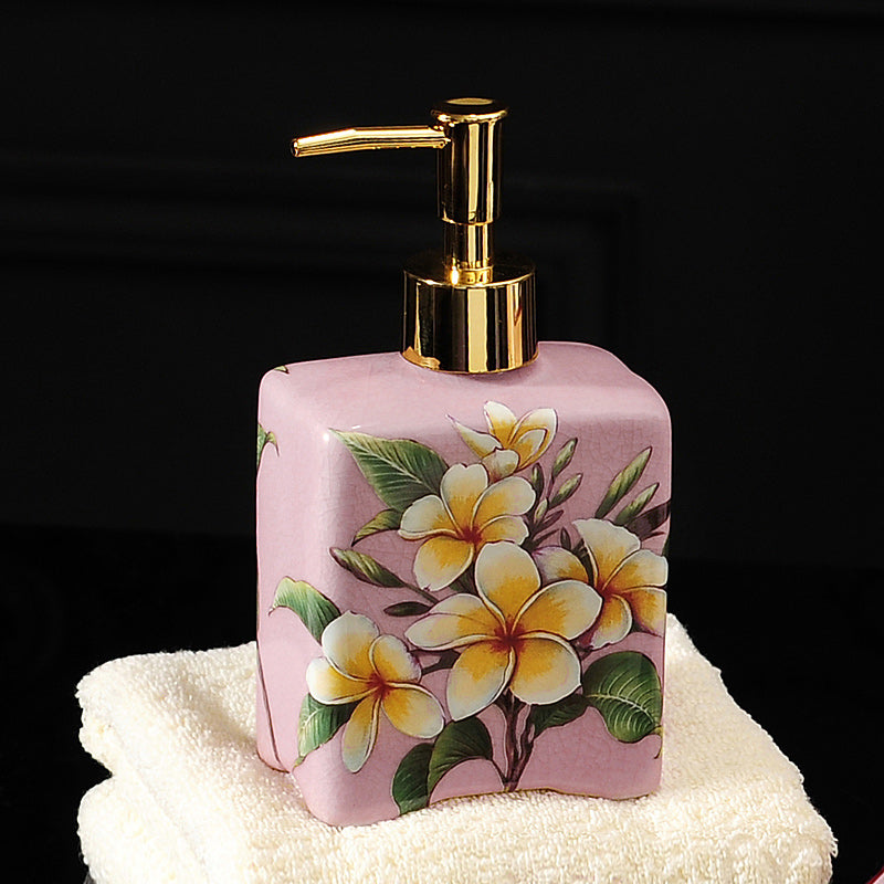 A Ceramic Sanitizer and Lotion Bottle by Maramalive™ on top of a towel.