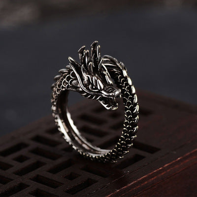 A black and white photo of a Maramalive™ silver Dragon Ring.