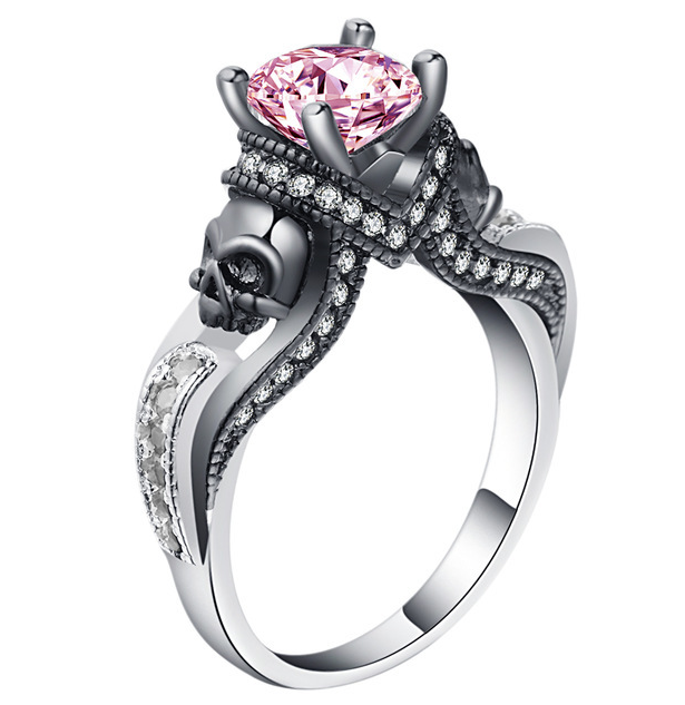 A Magical Gem Skull Ring for Adventurous Souls by Maramalive™, with a pink sapphire and skulls.