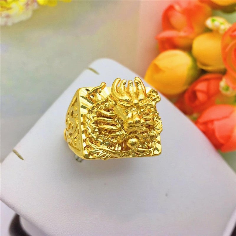 A Gold-Plated 3D Dragon Sand Gold Men's Ring with a dragon on it from Maramalive™.