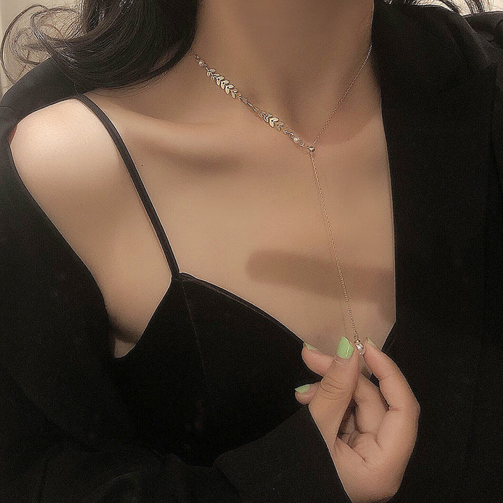A woman wearing a black jacket and a Maramalive™ Retro Clavicle Chain necklace.
