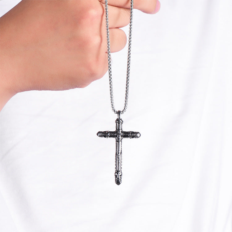 Punk Style Titanium Vintage Cross Pendant Necklace held by a hand