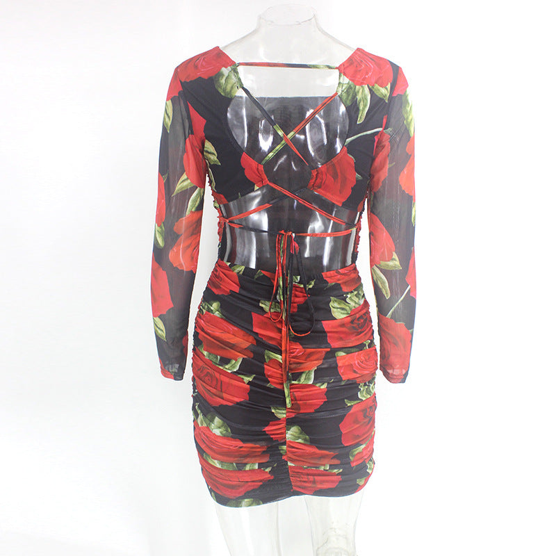 A woman wearing a Maramalive™ red and black rose print dress.