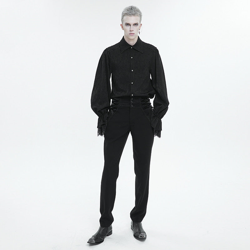 A person with short gray hair is standing against a plain white background, wearing a Maramalive™ Men's Ruffled Gothic Long Sleeved Shirt with decorative sleeves made of polyester, black high-waisted pants, and black shoes.