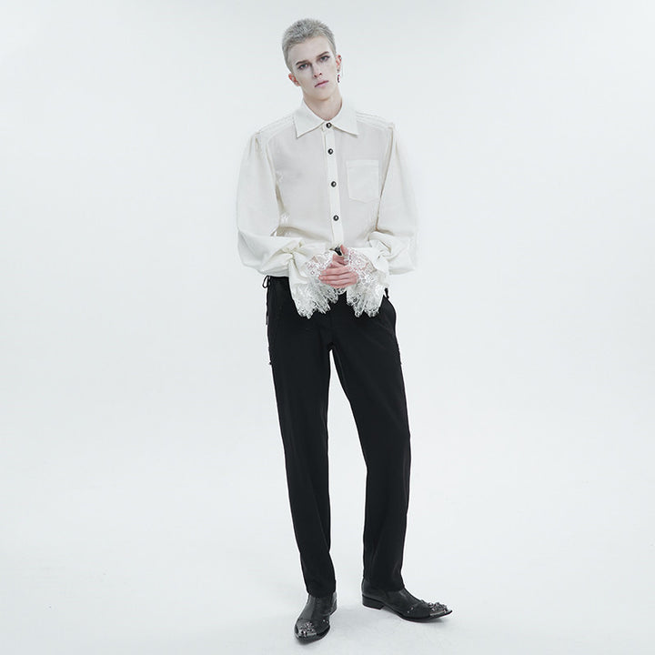 A person stands against a plain white background wearing a white, long sleeve Maramalive™ Men's Ruffled Gothic Long Sleeved Shirt with lace cuffs and black pants. The shirt features a square collar, and they have short hair, looking directly at the camera.