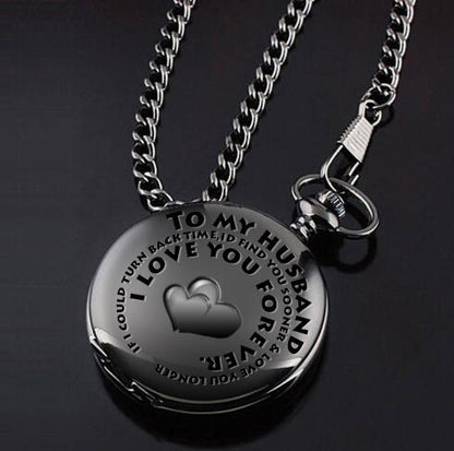 A Maramalive™ retro black fashion silver smooth steampunk quartz pocket watch on a stainless steel chain necklace, 30 cm long for men and women, with a gift box, on a black surface.