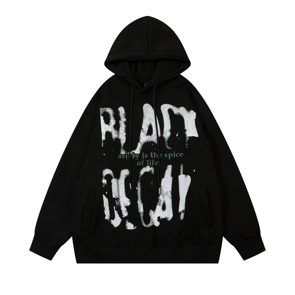 A black Fuzzy Hooded Sweater: Cozy Men's Pullover for Chilly Days by Maramalive™ featuring an abstract white paint design and the text "Variety is the spice of life" in green on the front.