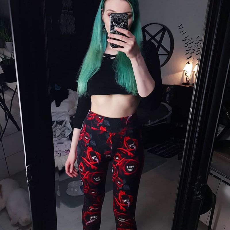 A woman taking a selfie in red and black Maramalive™ Gothic Rose Thigh-Highs - Gothic ladies tights.