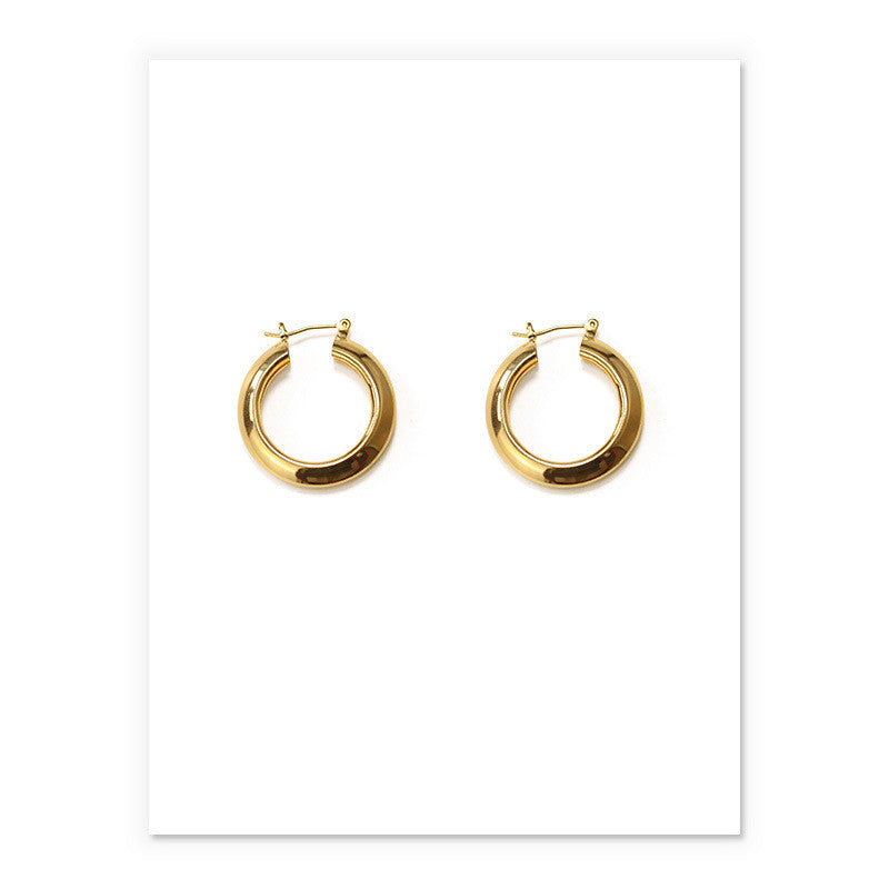 A pair of Circle Earrings by Maramalive™ on a white background.