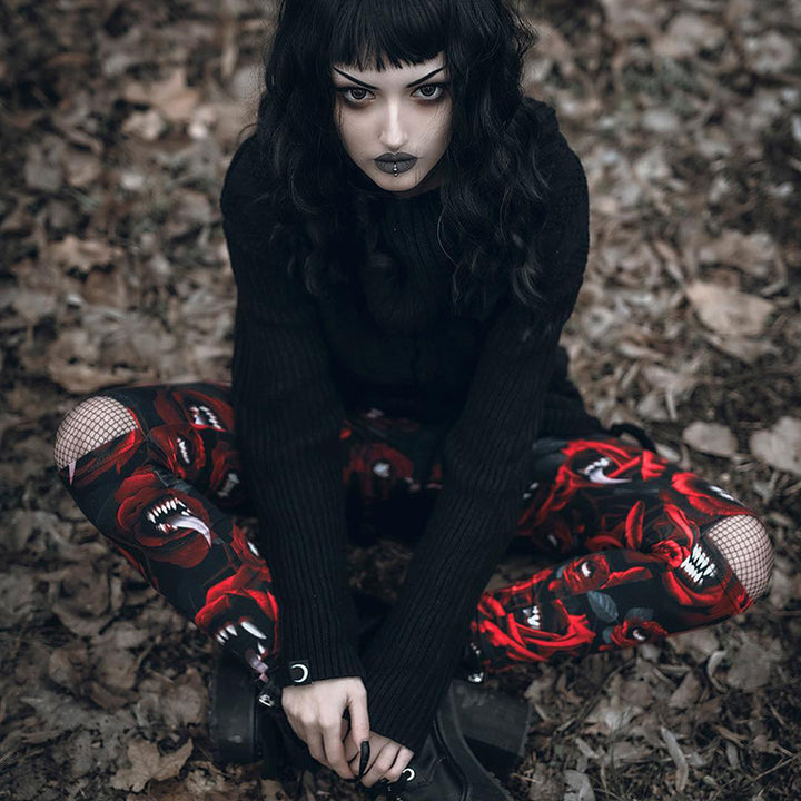 A woman taking a selfie in red and black Maramalive™ Gothic Rose Thigh-Highs - Gothic ladies tights.