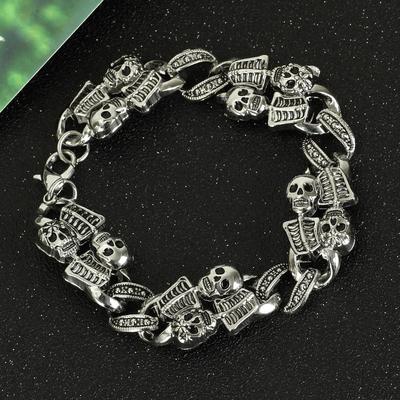 A Ghastly Glam: SKELETON VINTAGE BRACELET by Maramalive™, with morbidly marvelous skulls and chains.