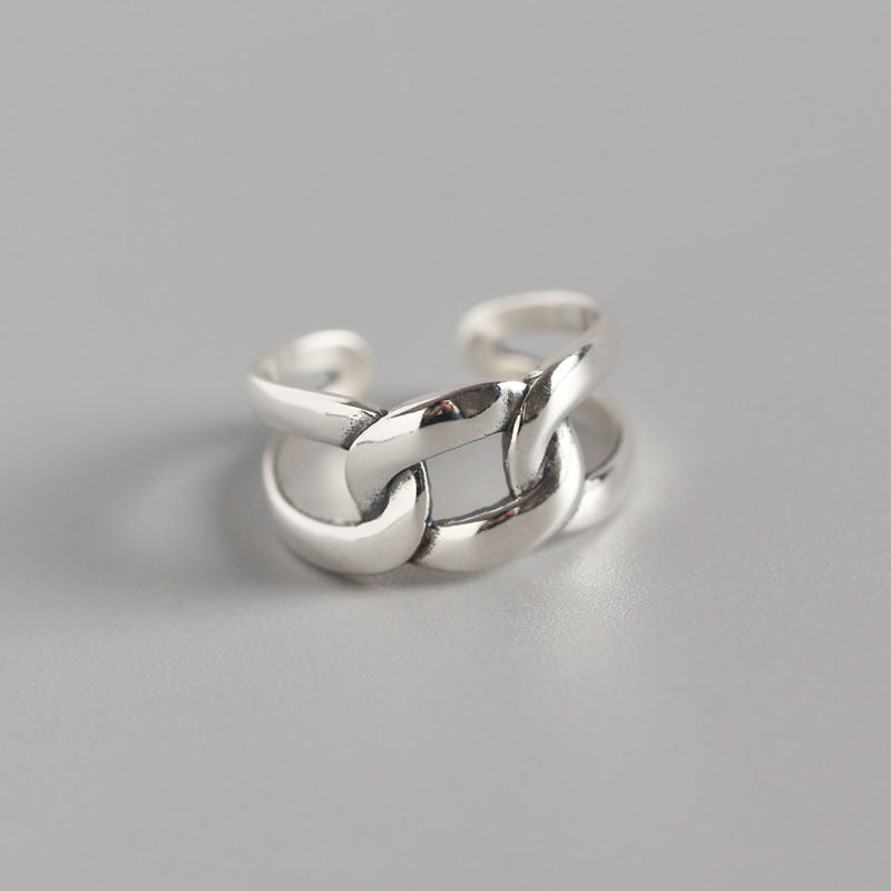 A Minimalist Sterling Silver Geometric Ring with a chain on it, by Maramalive™.