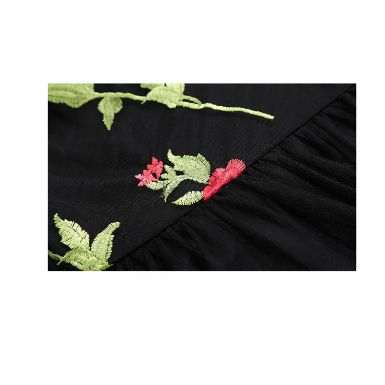 A black Maramalive™ evening dress with roses embroidered on it.