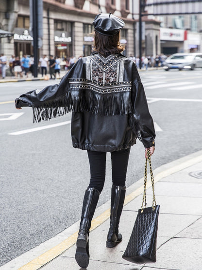 A woman wears a Maramalive™ ladies biker jacket leather- Embroidered, Tassels and Rivets.