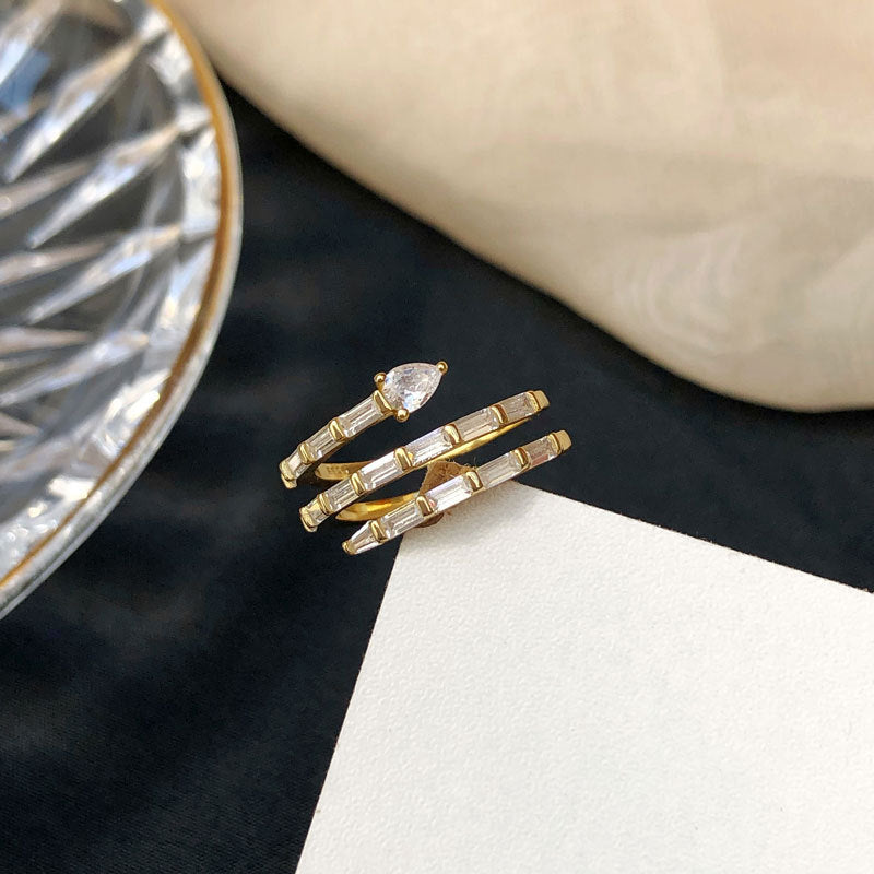 A pair of Maramalive™ Wave Ring for Women with diamonds.