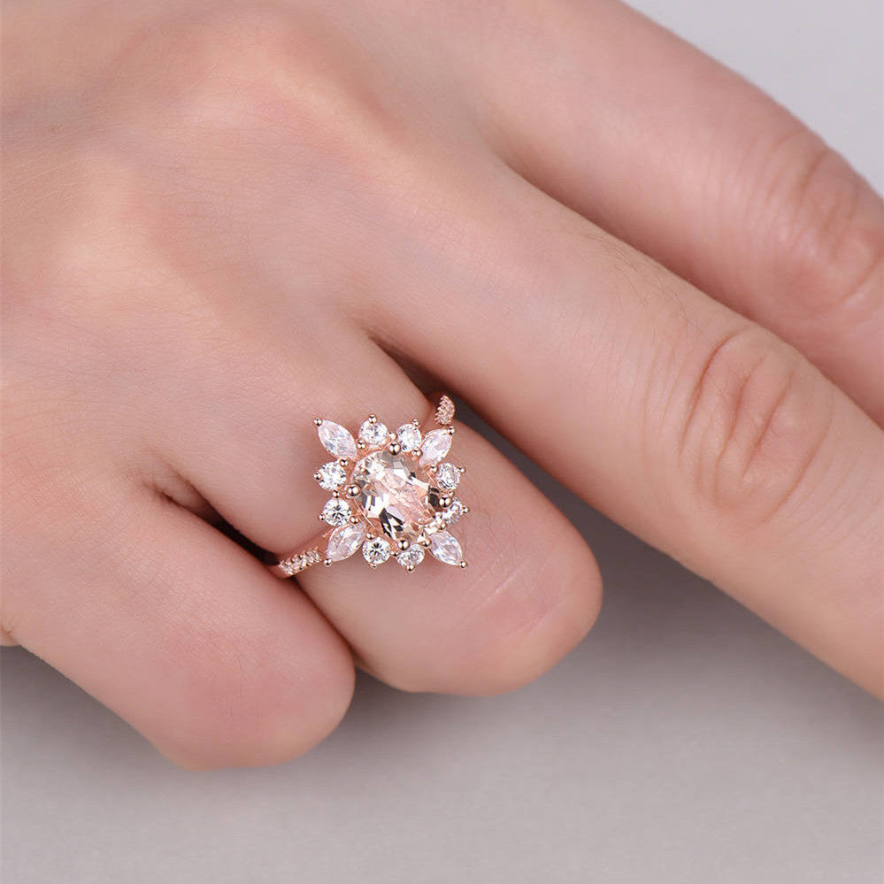 An engagement ring from Maramalive™ with a cluster of white diamonds.