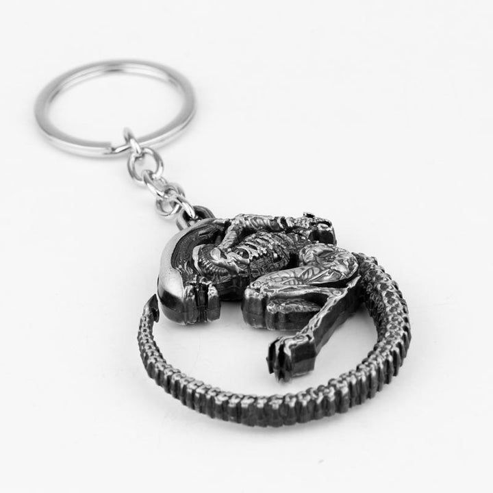 Two Simple And Creative Alien Battle Keychains with a skeleton on them, by Maramalive™.