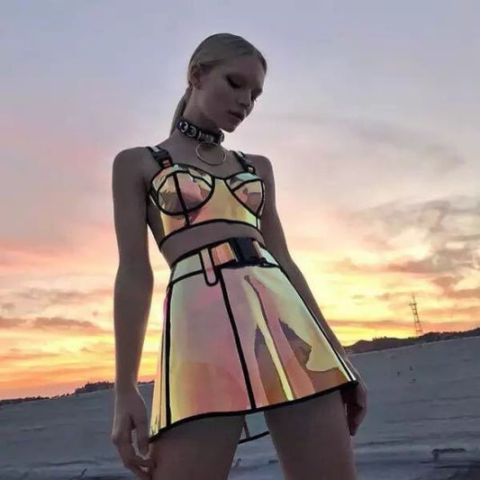 A woman wearing a Two-piece Laser Cool Rock And Roll Costume made by Maramalive™, consisting of a reflective mirrored skirt and top crafted from polyester fiber.