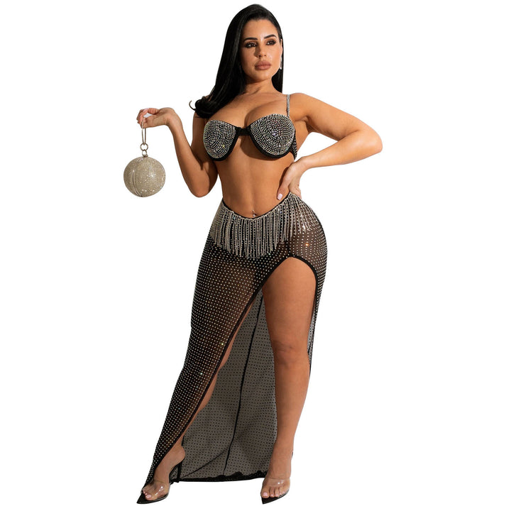 A woman is posing in a Fun & Flirty Women's Mesh Rhinestone Tassel Dress for the Beach by Maramalive™.