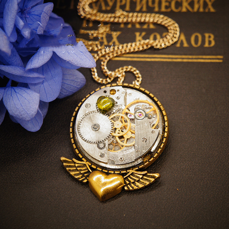 A close up of a Maramalive™ Hollow Steampunk Vintage Necklace Brooch Dual Purpose on a chain.