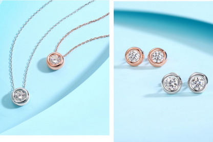 A Round Inlaid Moissanite Jewelry Set Must-have for a Fashionable Woman by Maramalive™, consisting of a silver necklace and earring set with diamonds.