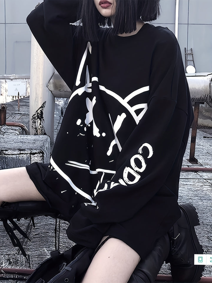 Person with black hair sits on a rooftop wearing an oversized Maramalive™ Graffiti Print Crew Neck T-Shirt, Casual Loose Long Sleeve Top For Spring & Fall, Women's Clothing and black shorts. The background features urban rooftop structures and vents, enhancing the Y2K style vibe of the scene.