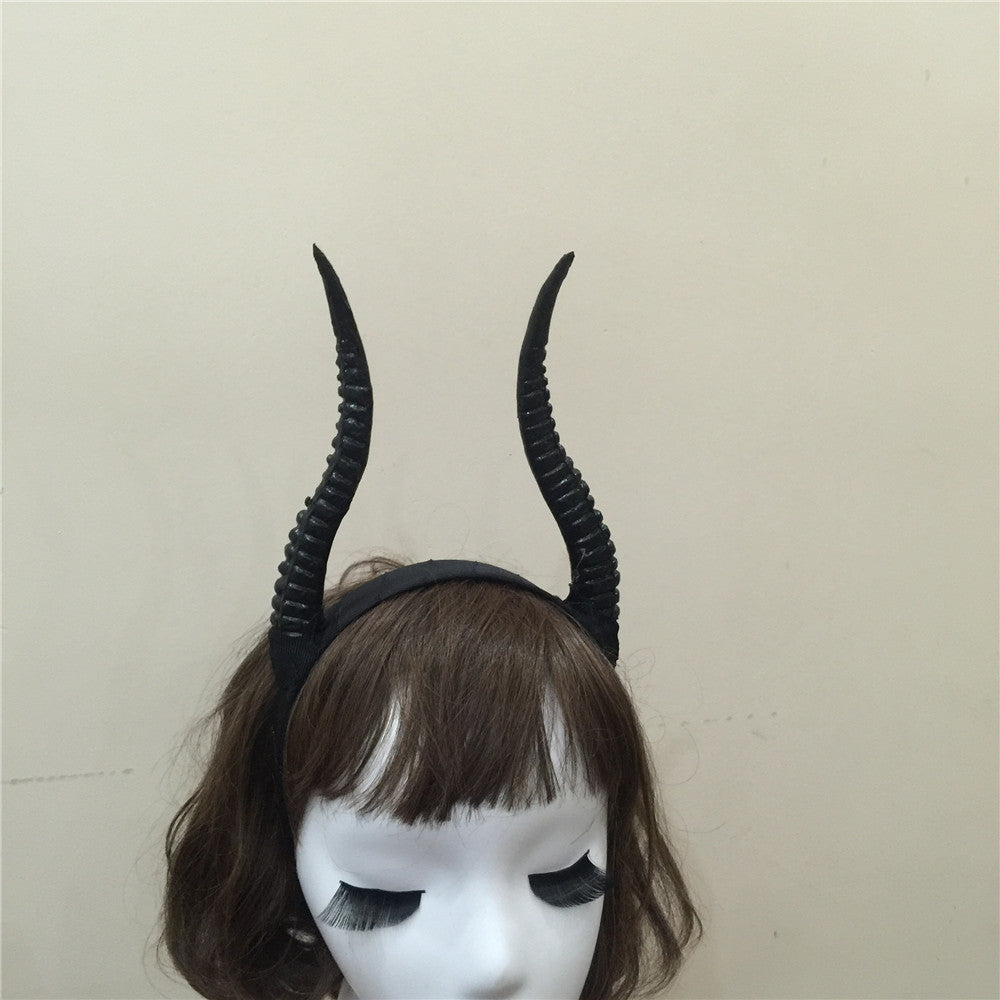 A Gothic Devil Horn Headband - Macabre Demon Antler Headpiece by Maramalive™, with demon antler horns.